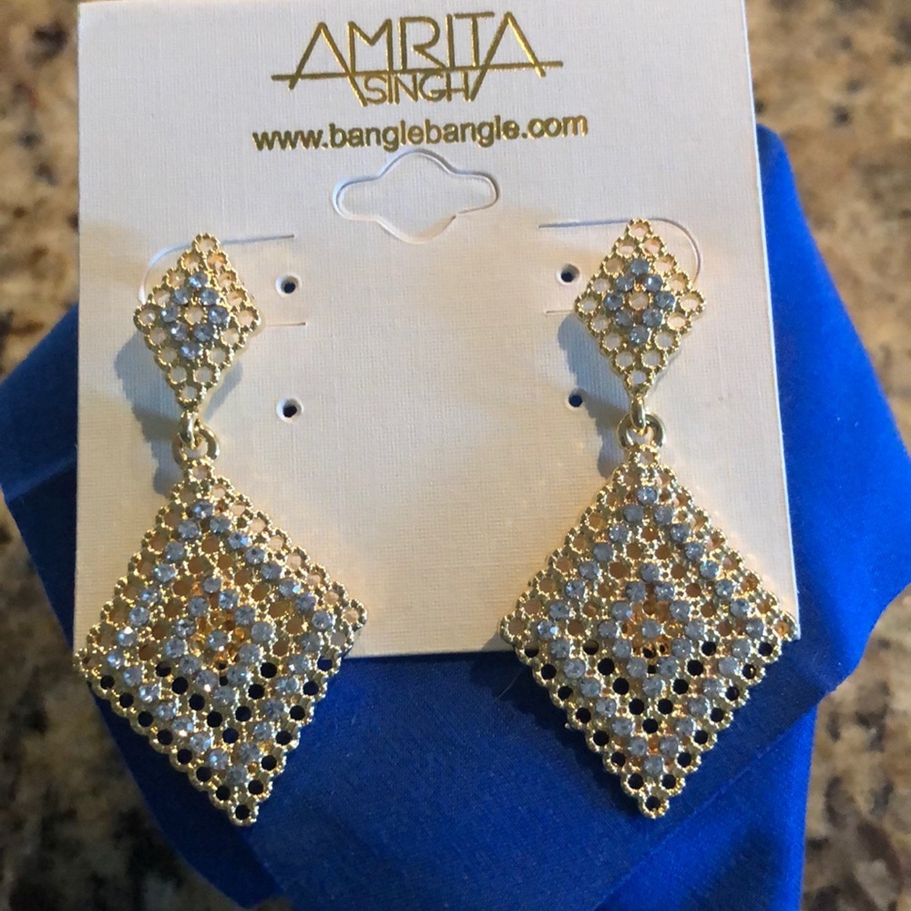 Gold tone and crystal earrings. Brand new!!